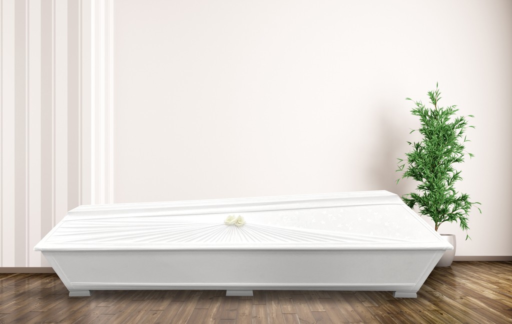 Coffin with floral-patterned fabric